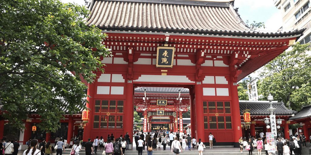 Senso-ji Shrine with its red gate and visitors.