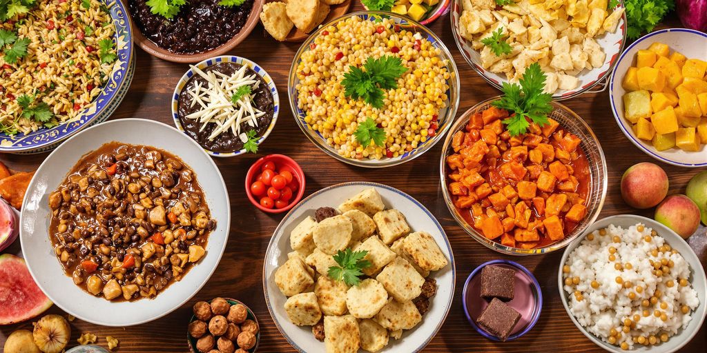 Colorful Brazilian dishes on a rustic wooden table.