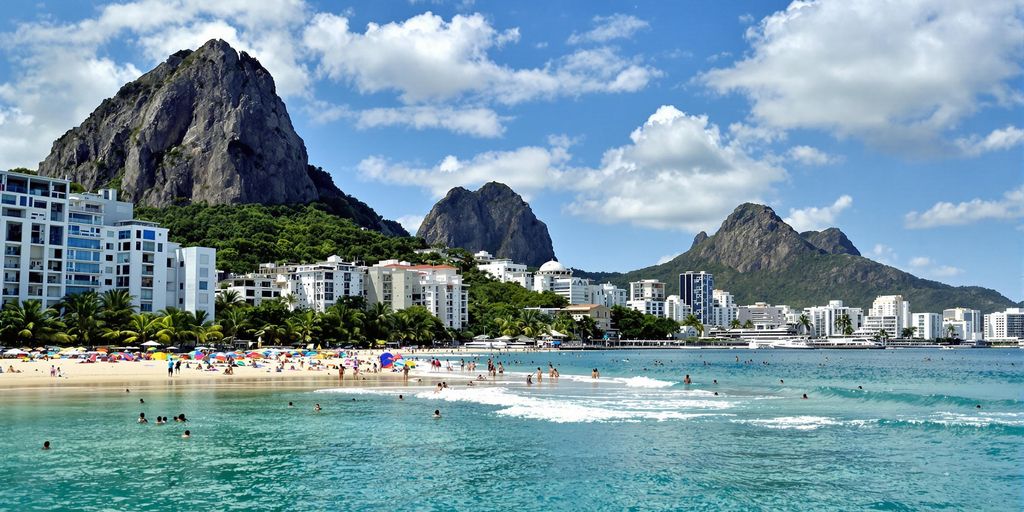 Rio de Janeiro beach with sunbathers and iconic mountains.