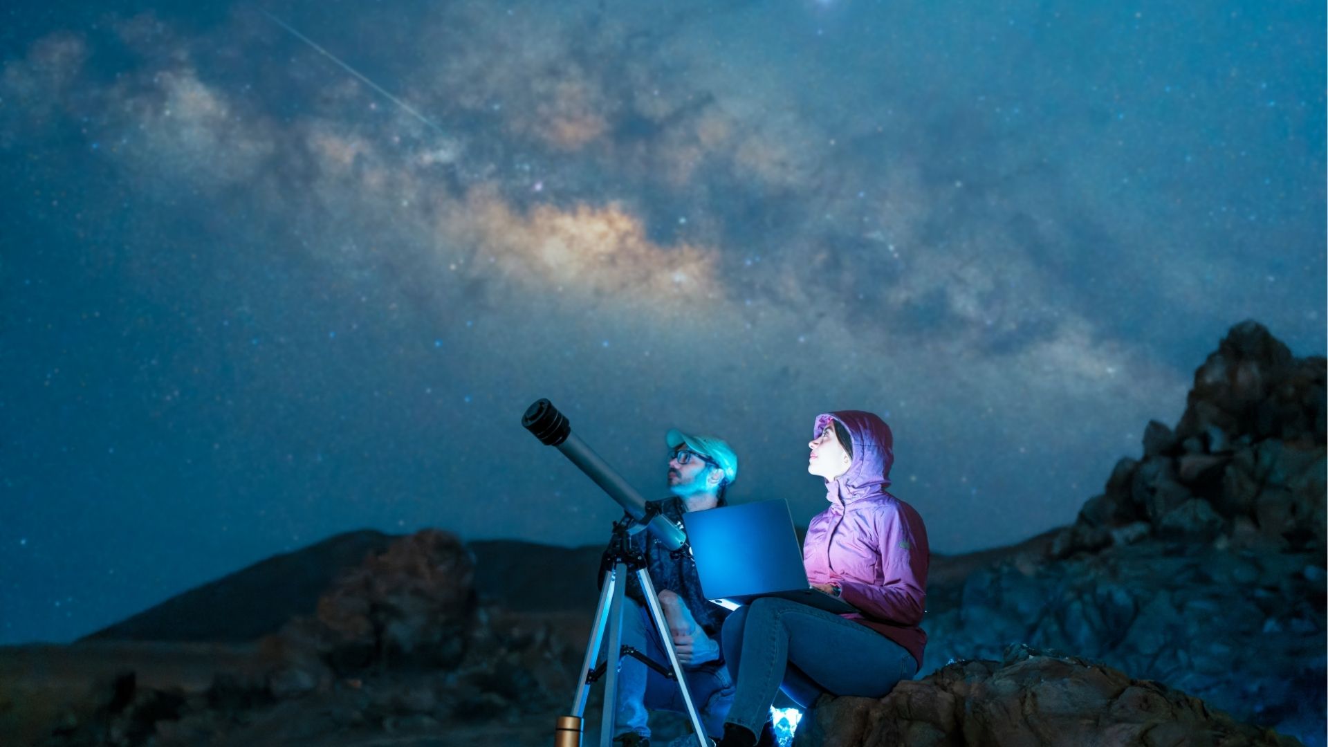 Stargazers under a starry sky