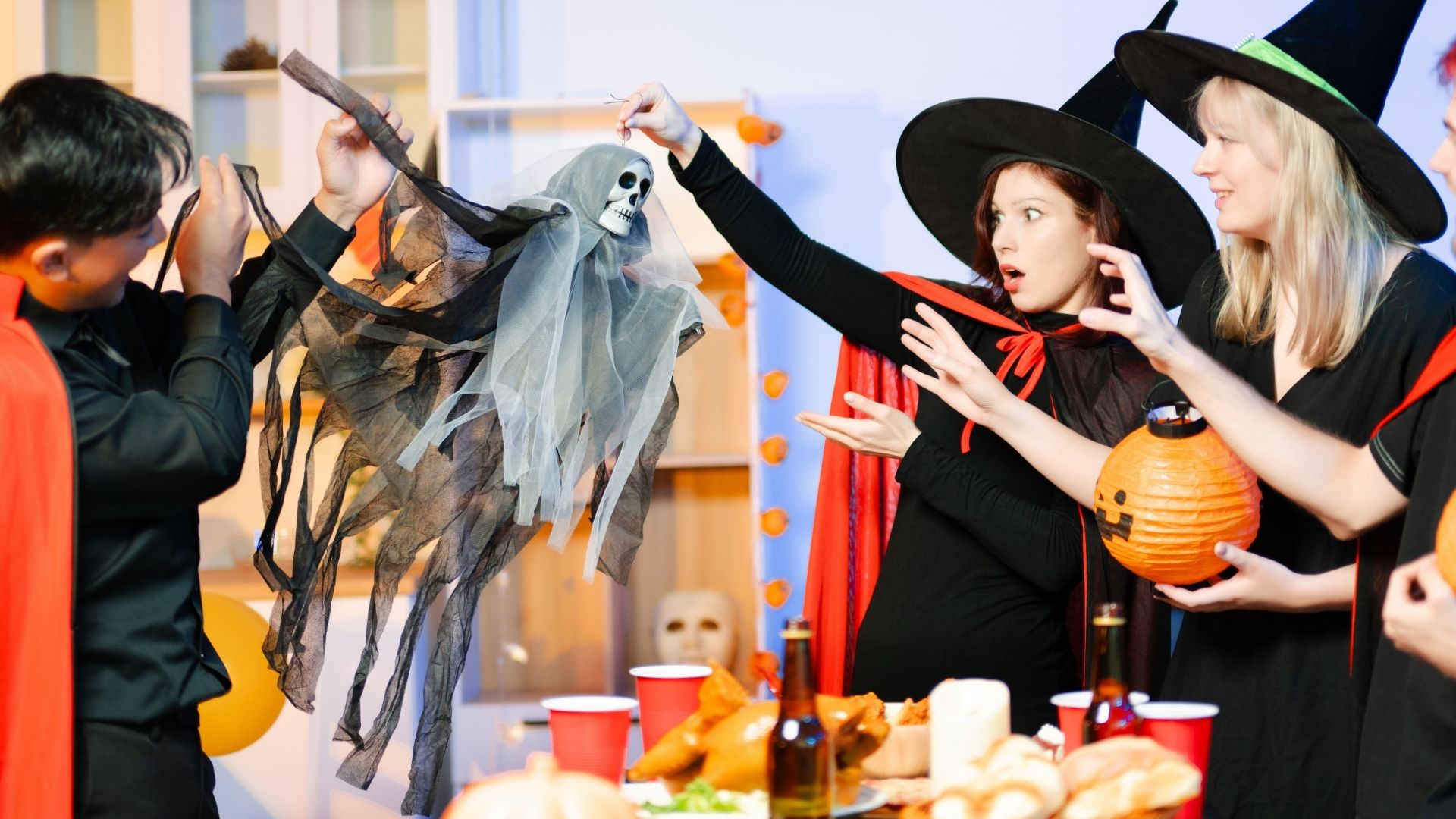 Group celebrating Halloween with costumes