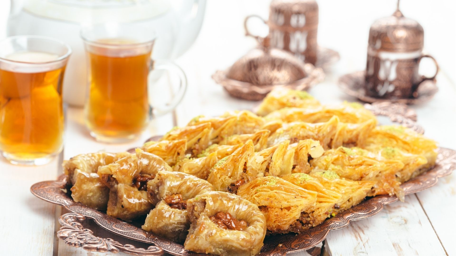 Tray of baklava with tea glasses