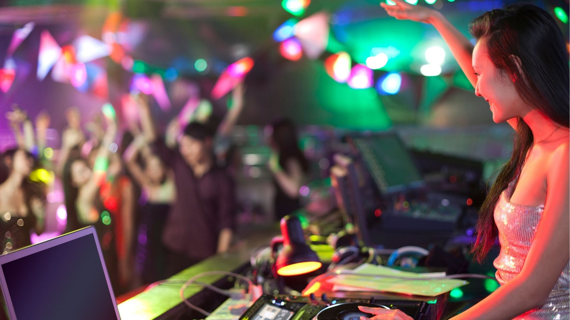 DJ doing record Scratching in nightclub