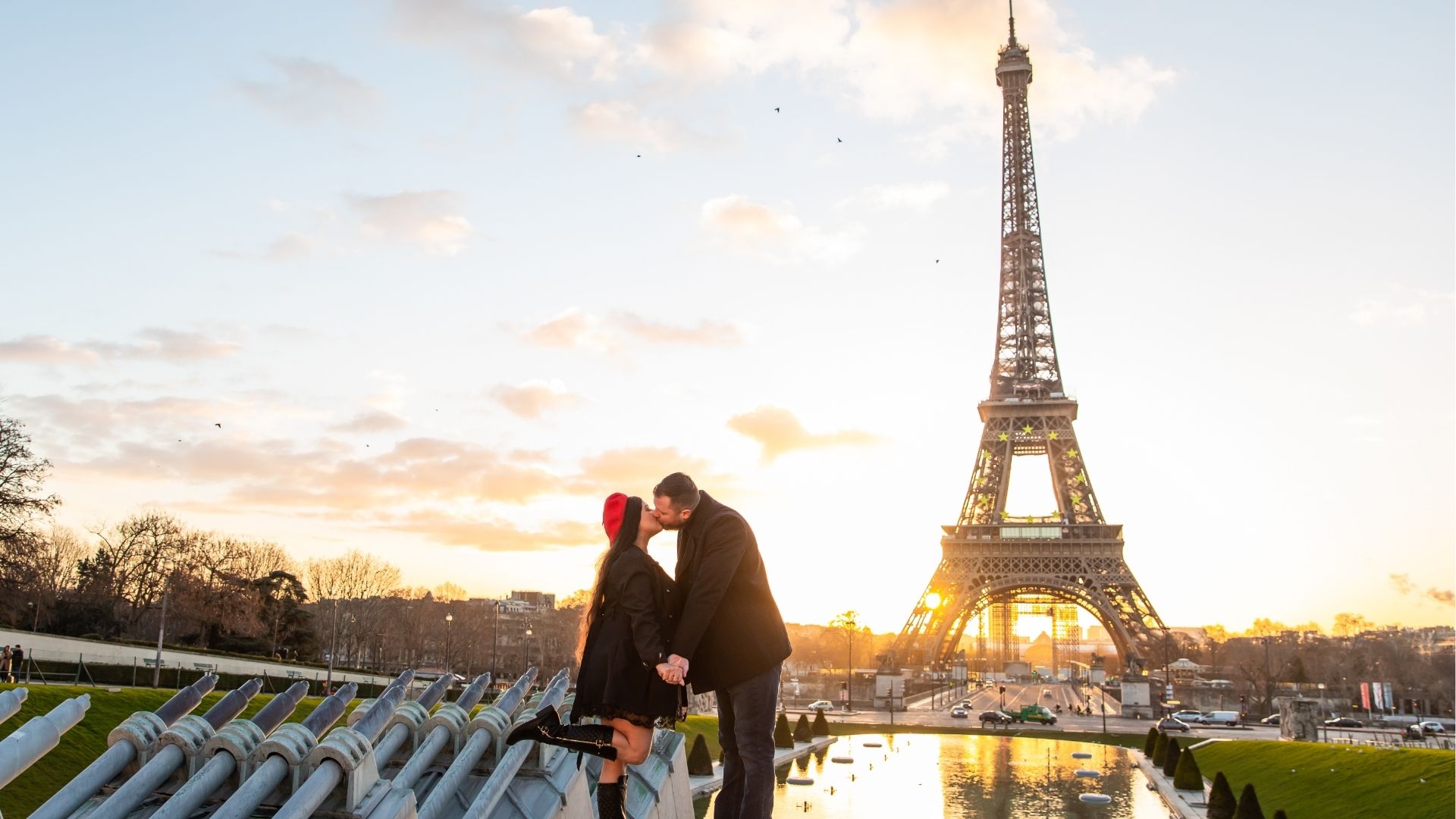 Lovers sharing a kiss in front of Eiffel Tower