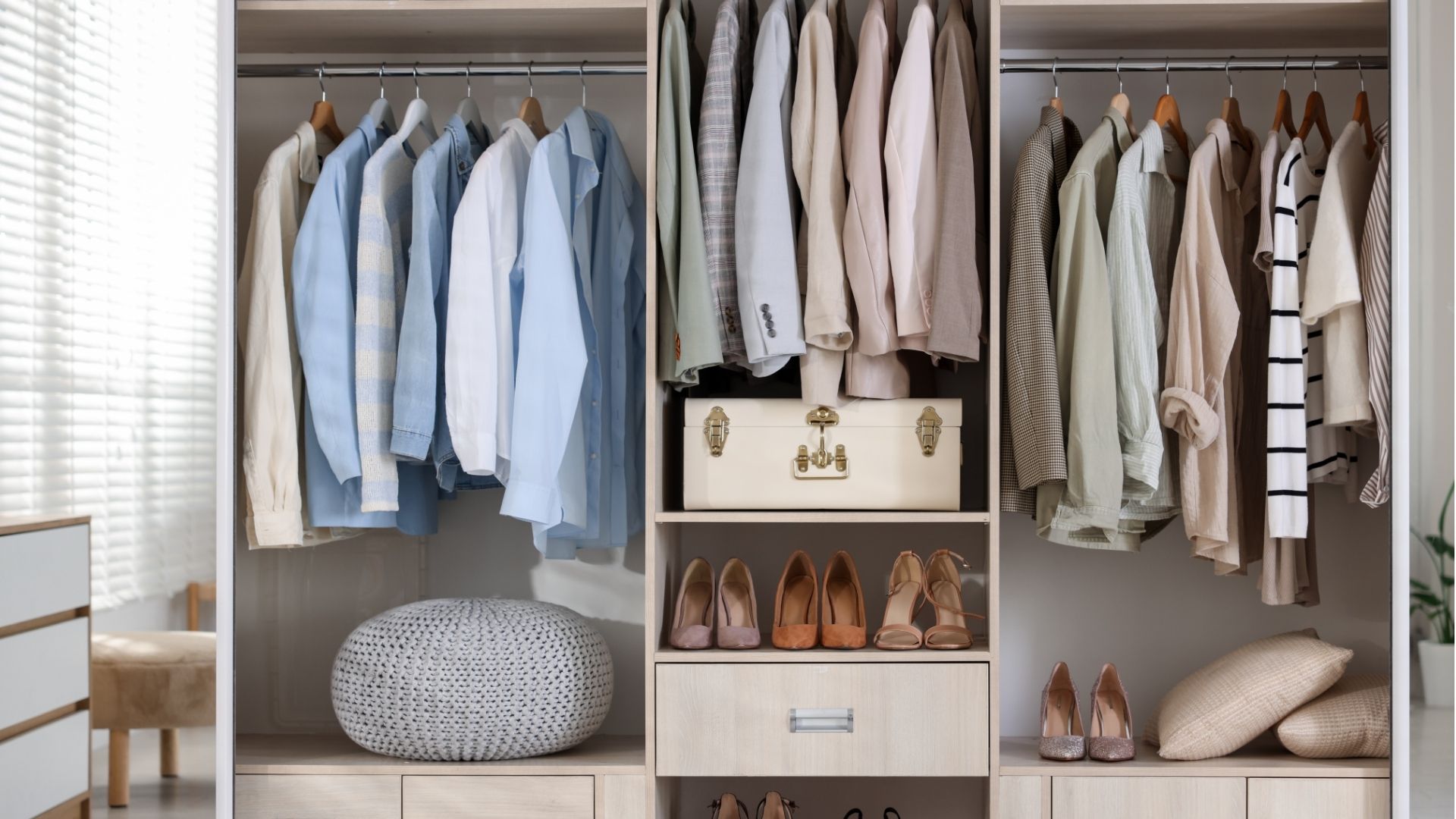 Shelving unit with different stylish clothes 
