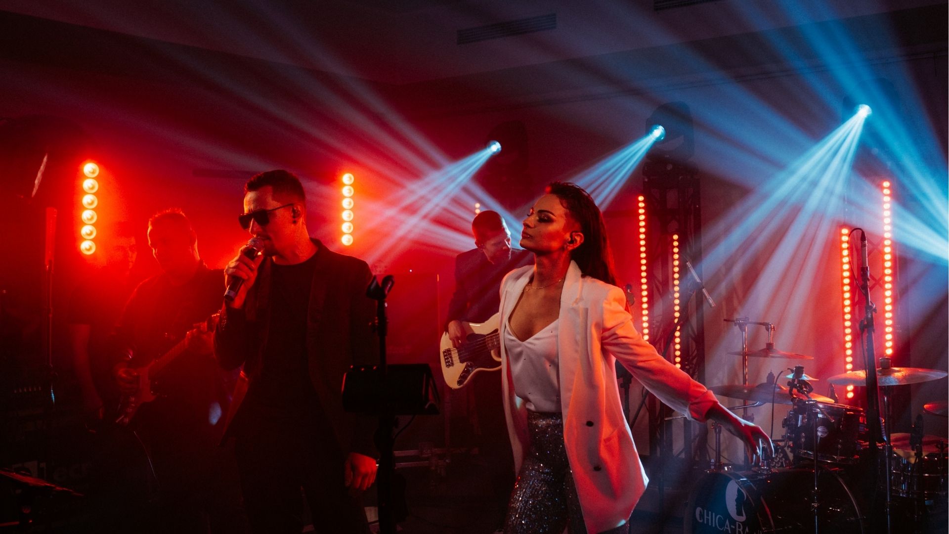 Live performance on stage in a nightclub.