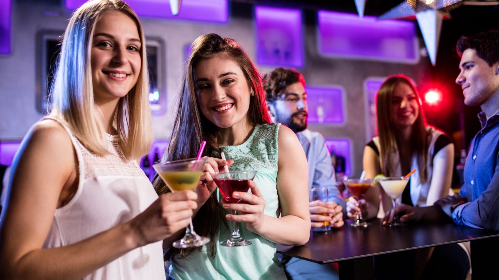 Fiends having cocktail at bar counter
