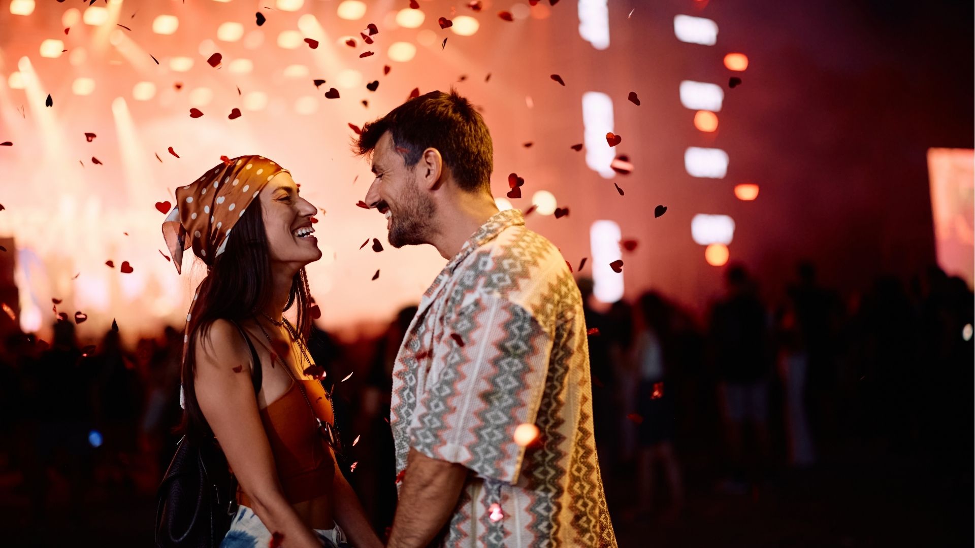 Couple laughing and enjoying music festival