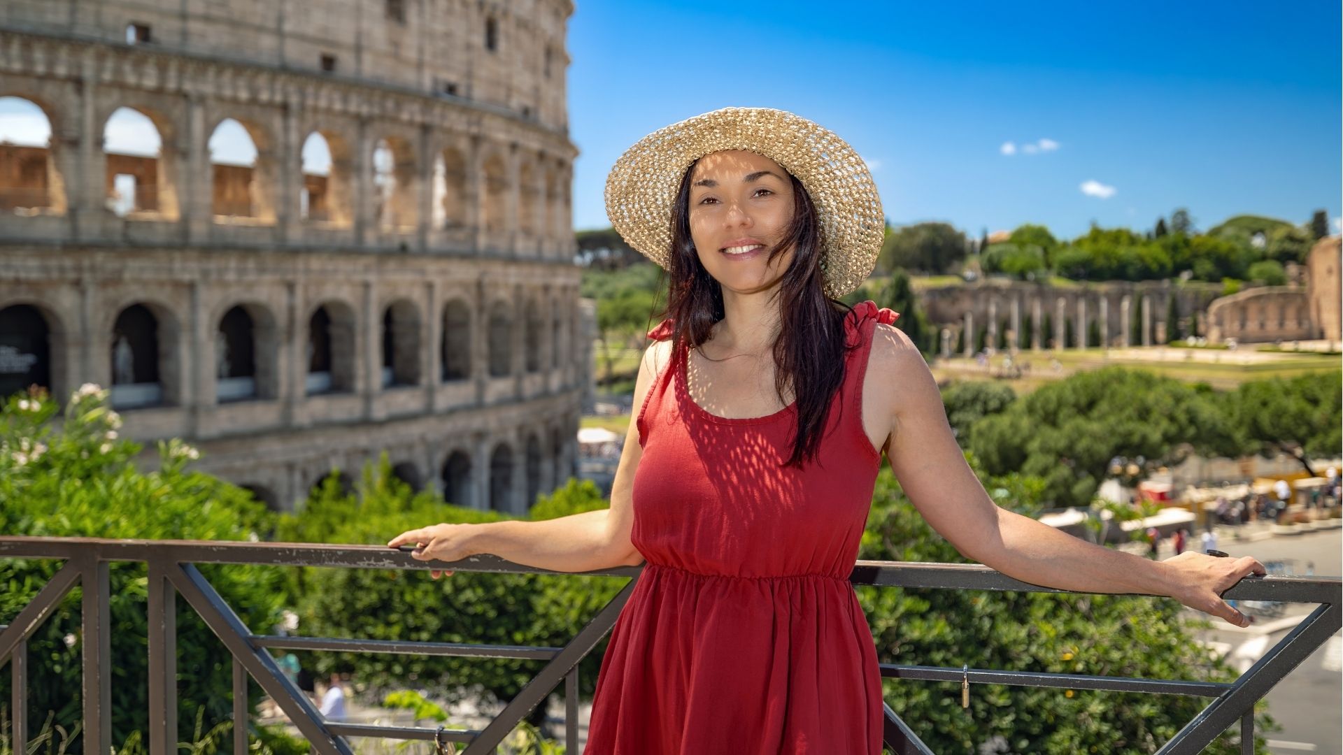 A girl on holiday in Rome visits the Colosseum