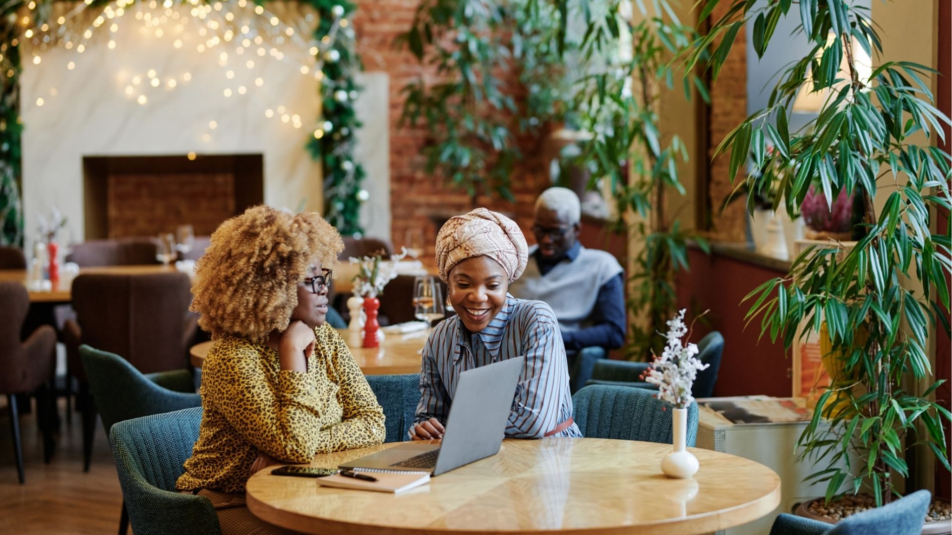 Women working together in cafe