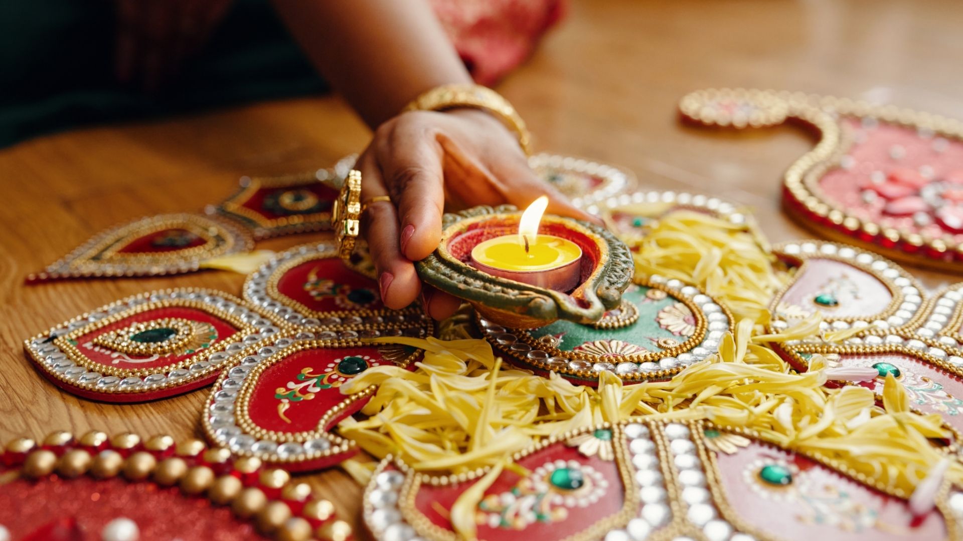 Diya on festive rangoli
