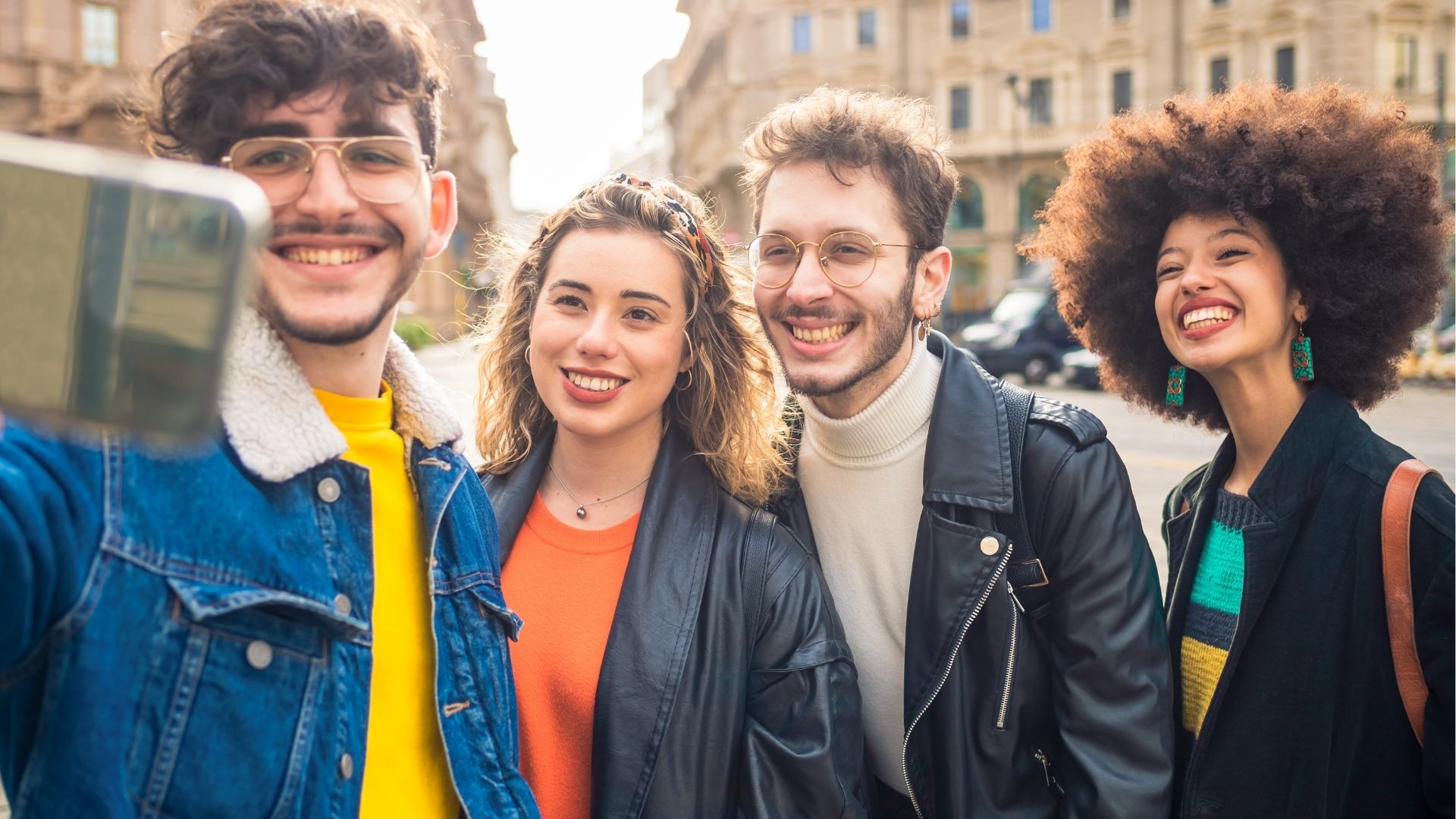 Group of friends outdoors having fun and taking a selfie