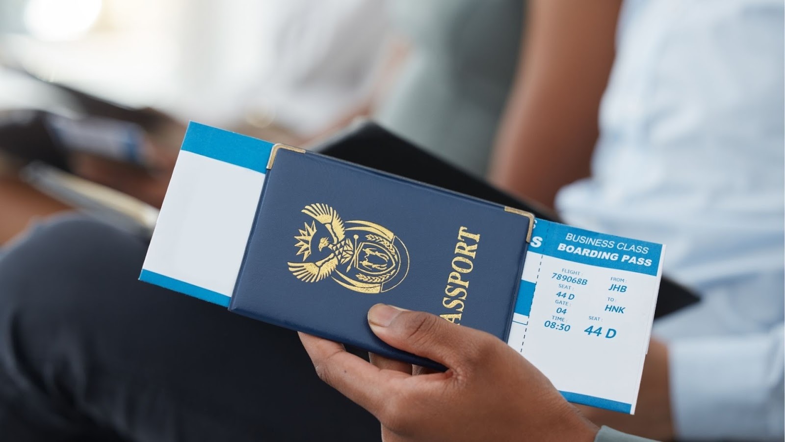 Traveler checking passport and boarding pass