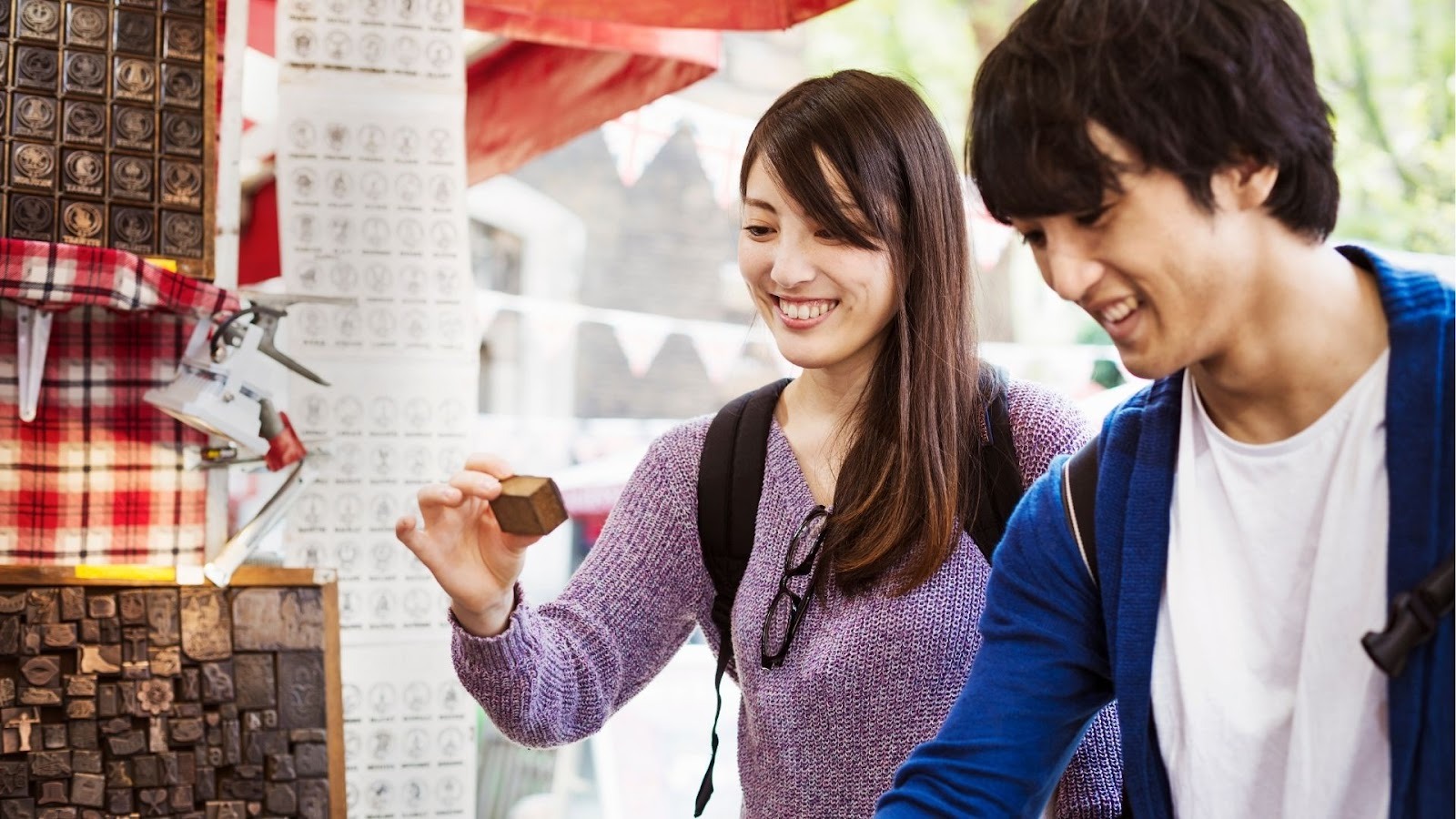 Visitors exploring a local souvenir market in Japan