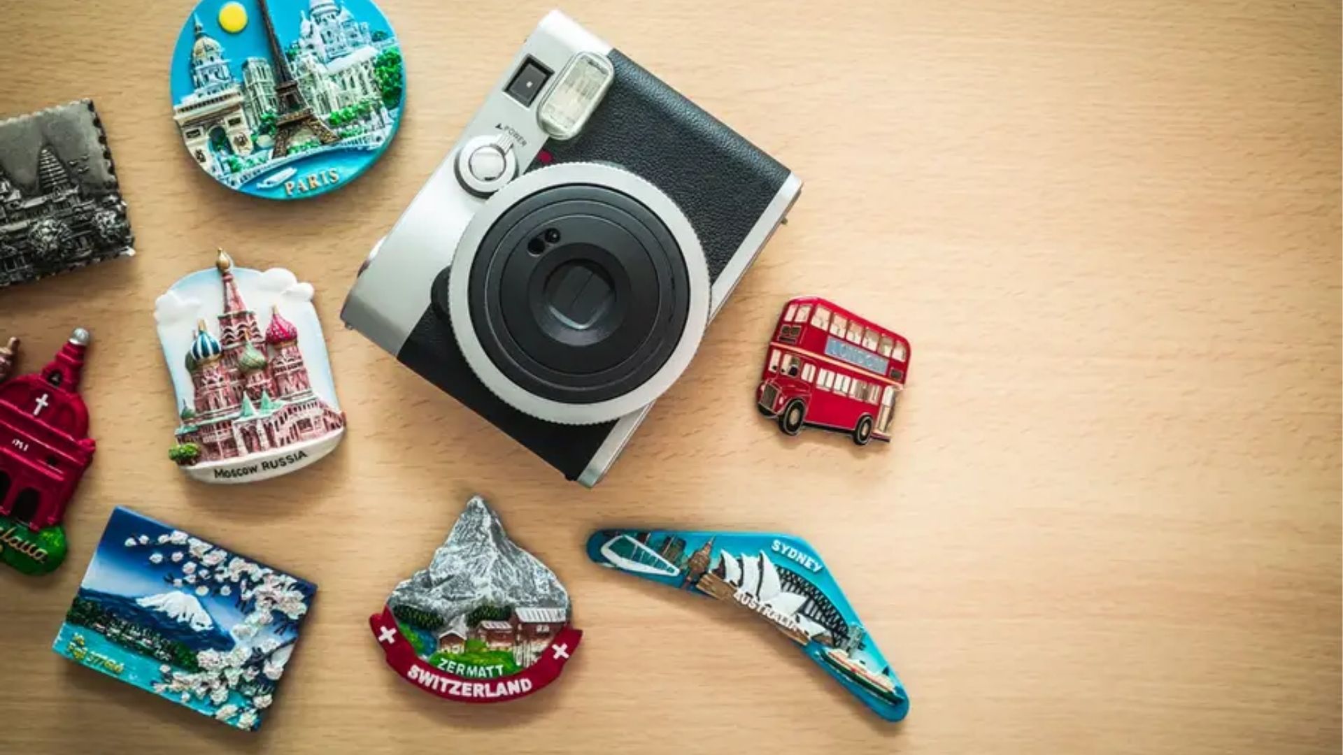 Collection of Sydney souvenirs arranged on a wooden surface.