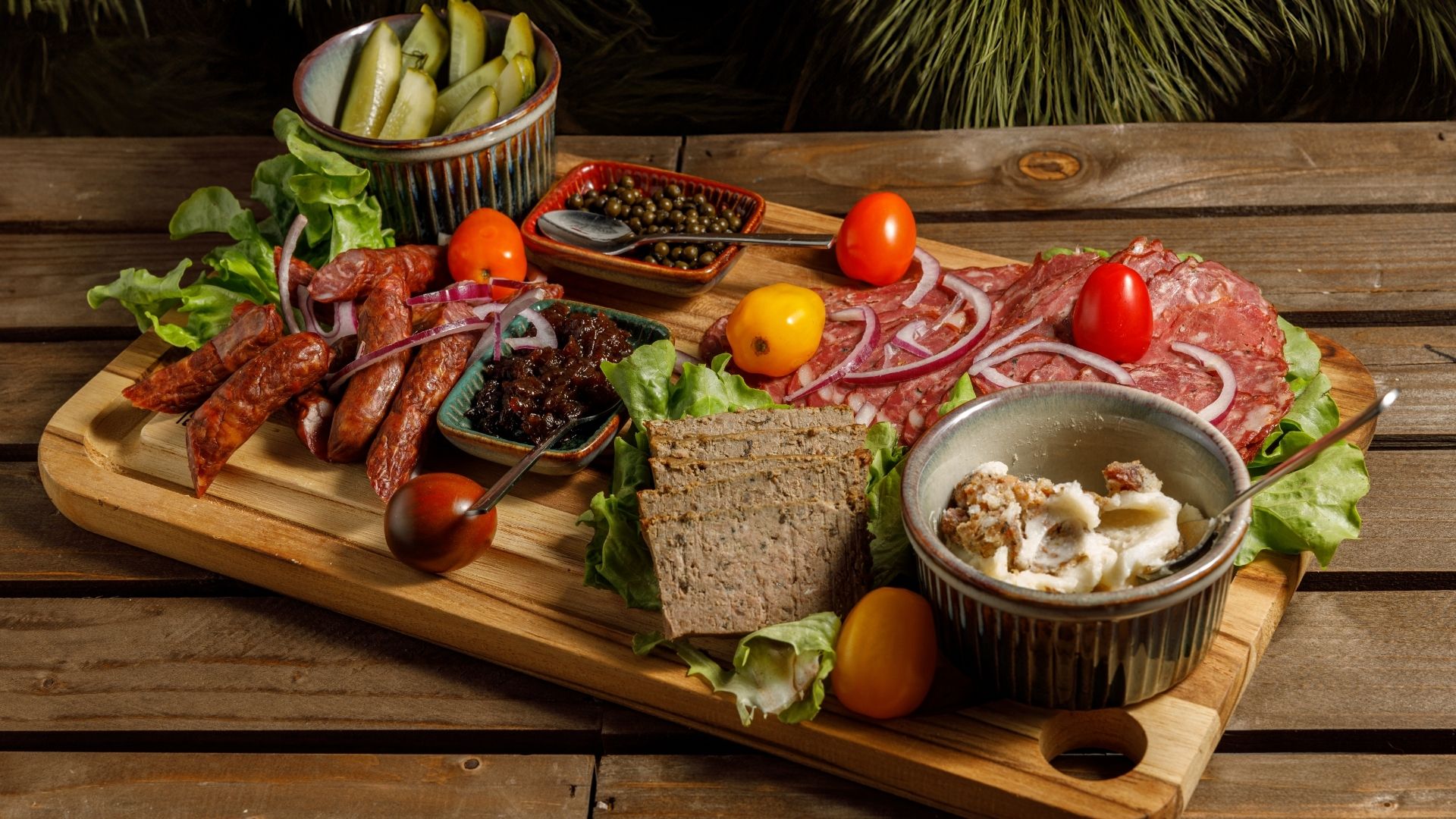 Artisan Charcuterie Board with a variety of delightful treats and fresh vegetable colors
