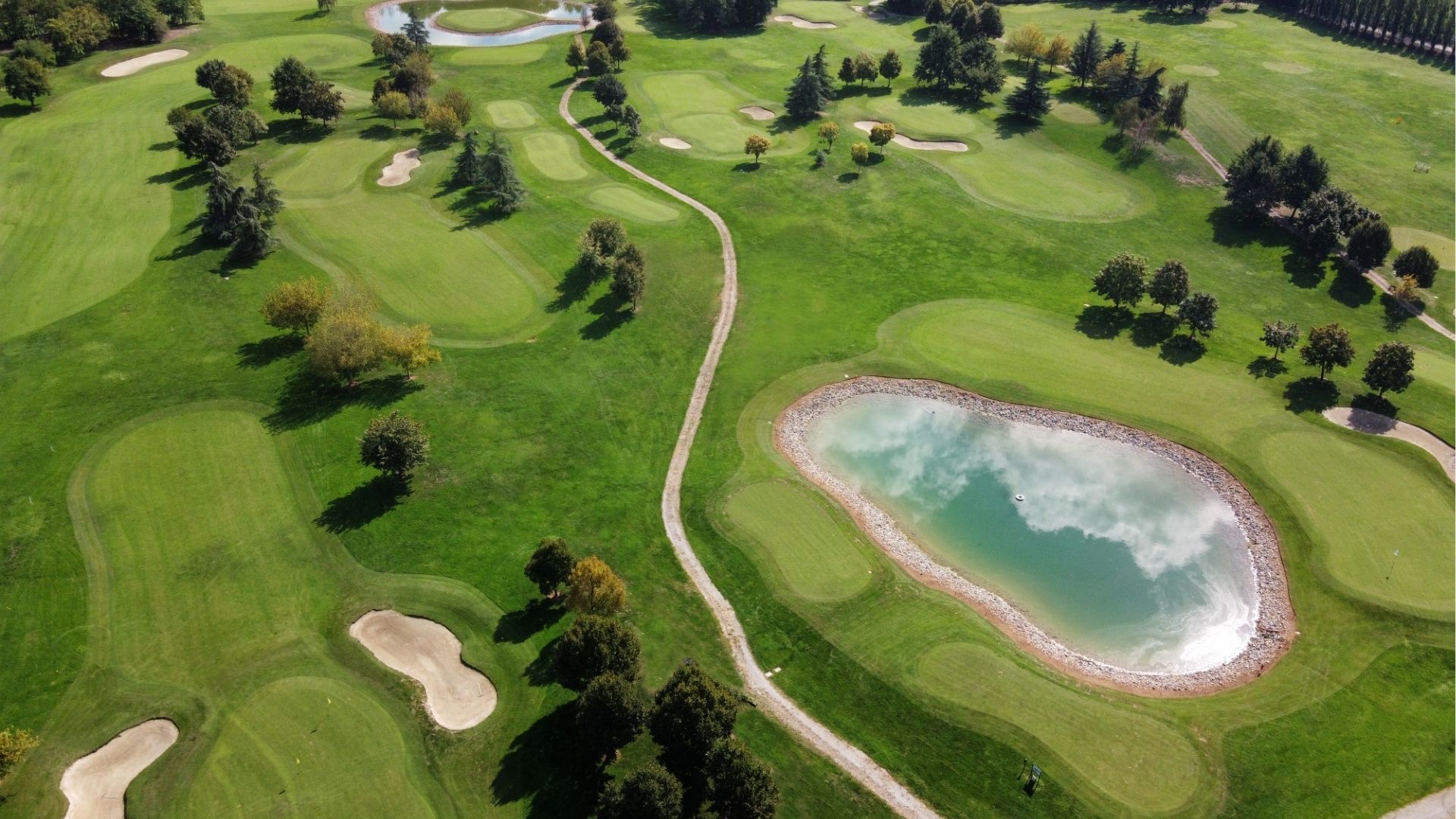 Luxury golf club field in sunlight
