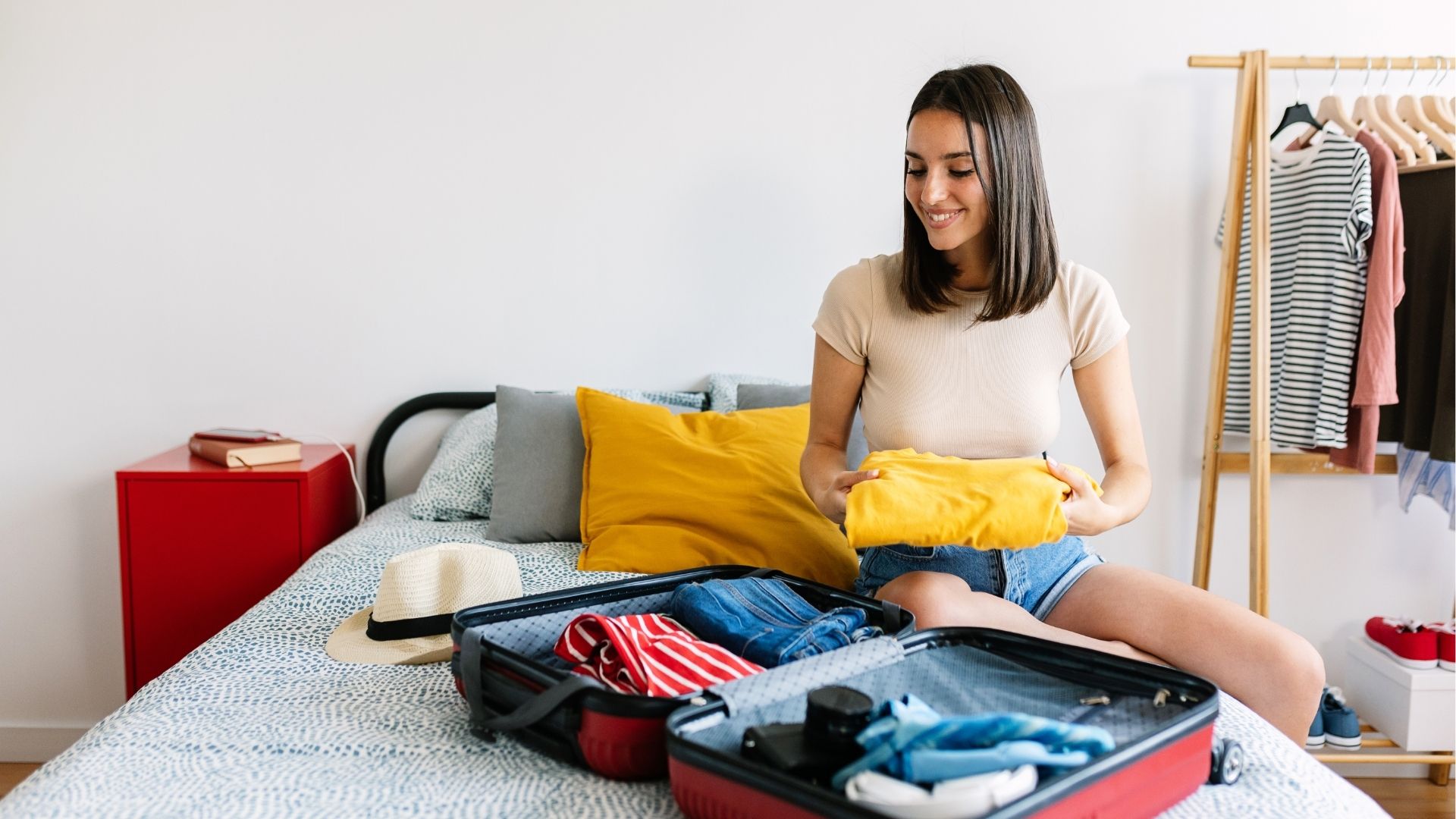 Woman packing suitcase for solo trip