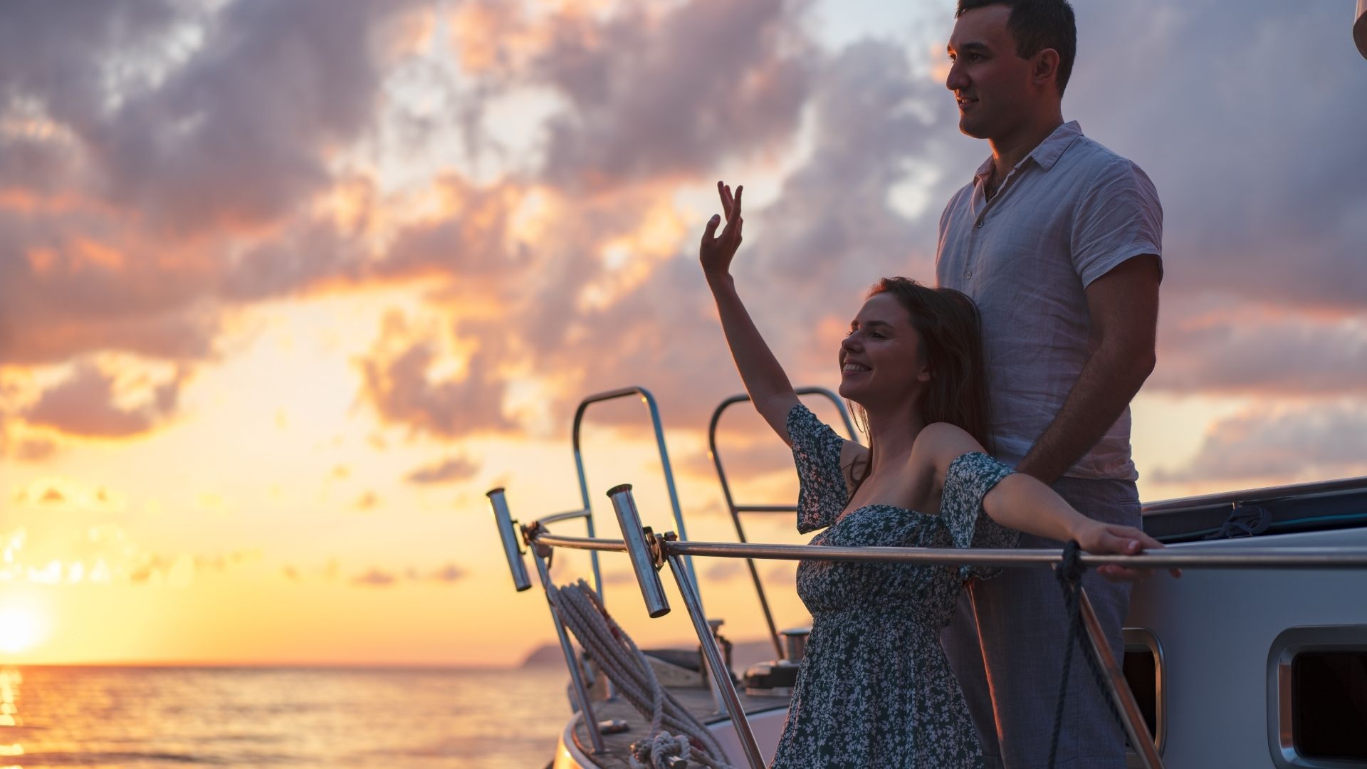 Couple relaxing on a cruise ship at sunset