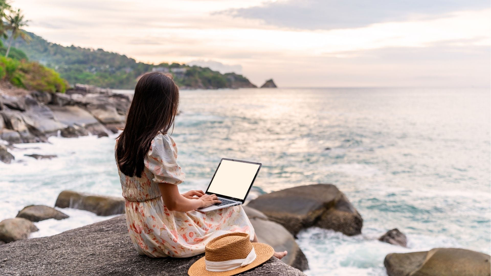 Young woman freelancer traveler working online using laptop while traveling
