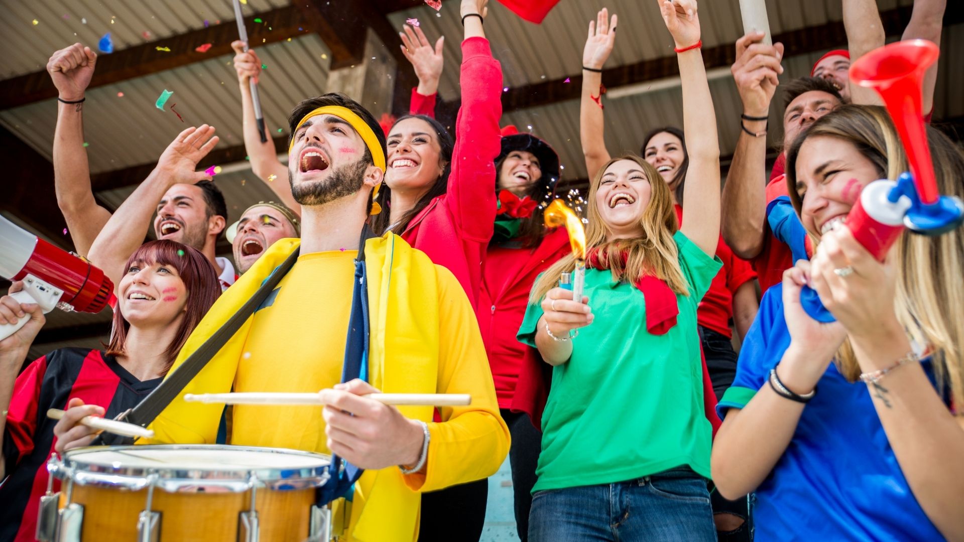 Group of happy fans are cheering for their team victory