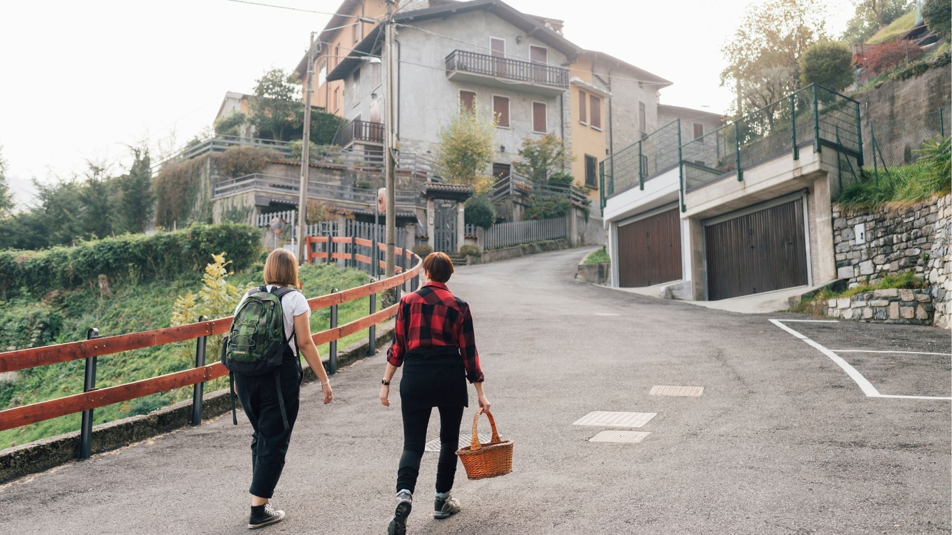 Friends on hillside road, Rezzago, Lombardy, Italy