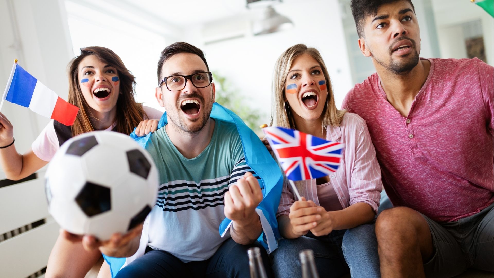 Group of people celebrating football game

