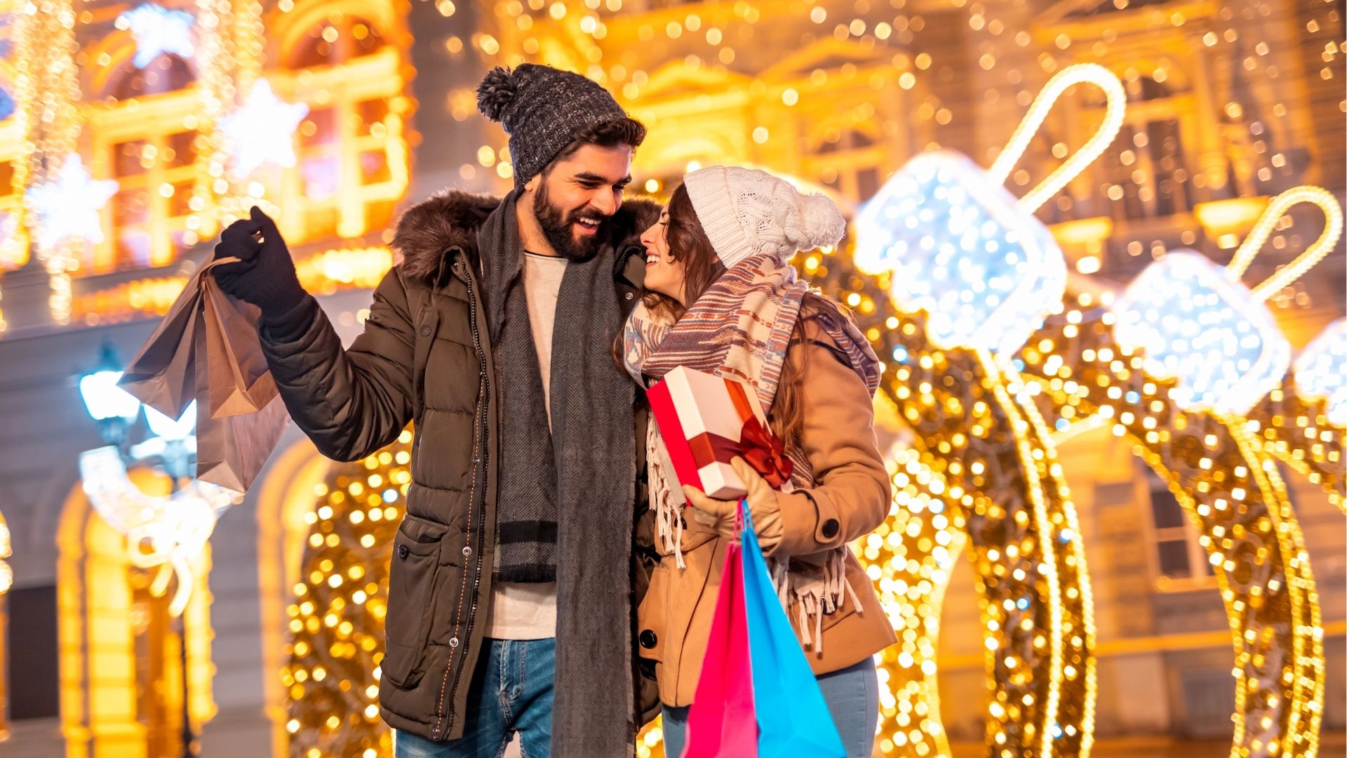 Couple having fun doing Christmas shopping