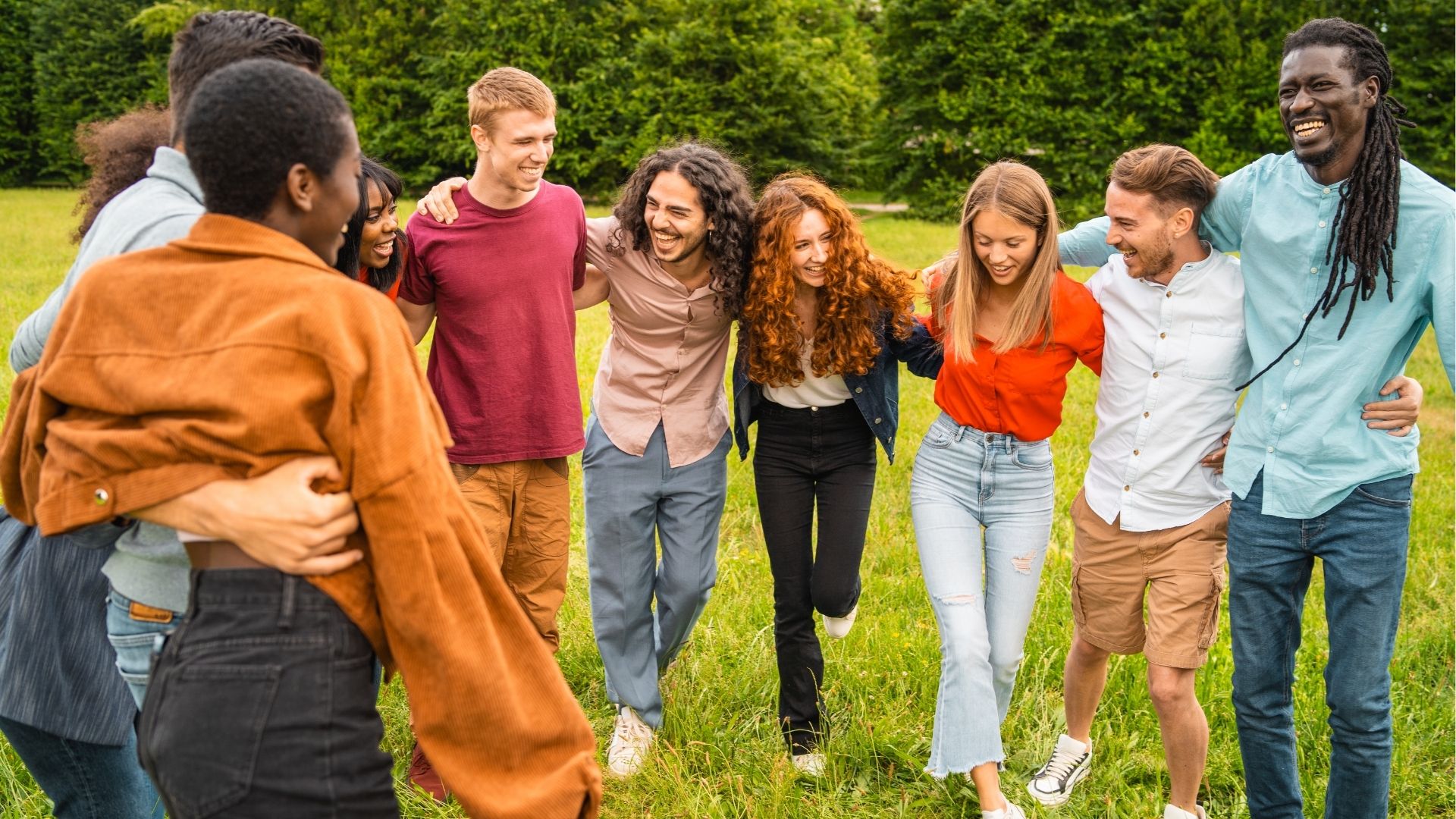 Group of young friends having fun outdoors in a park