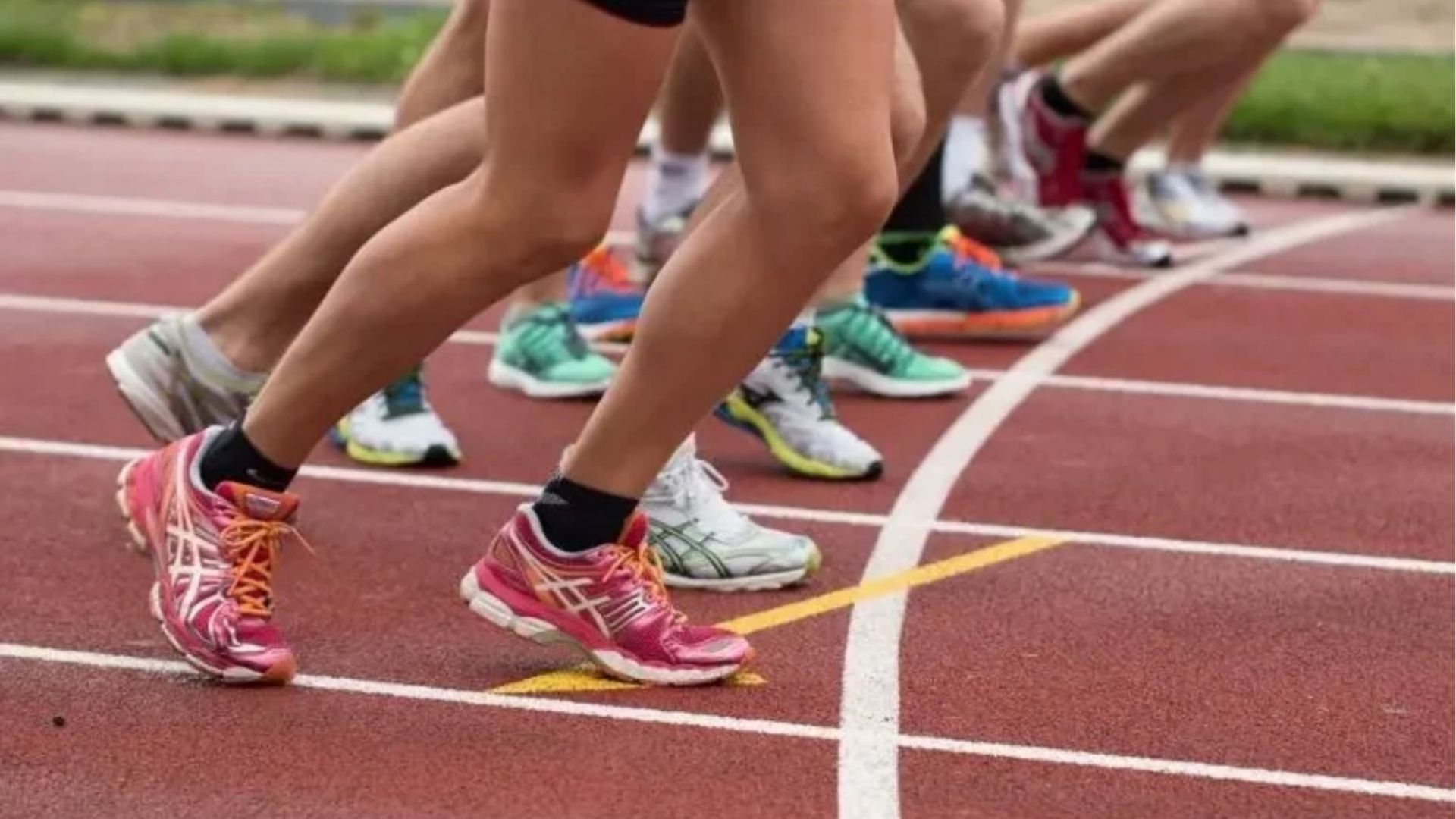 Athletes sprinting on a track during a competitive race