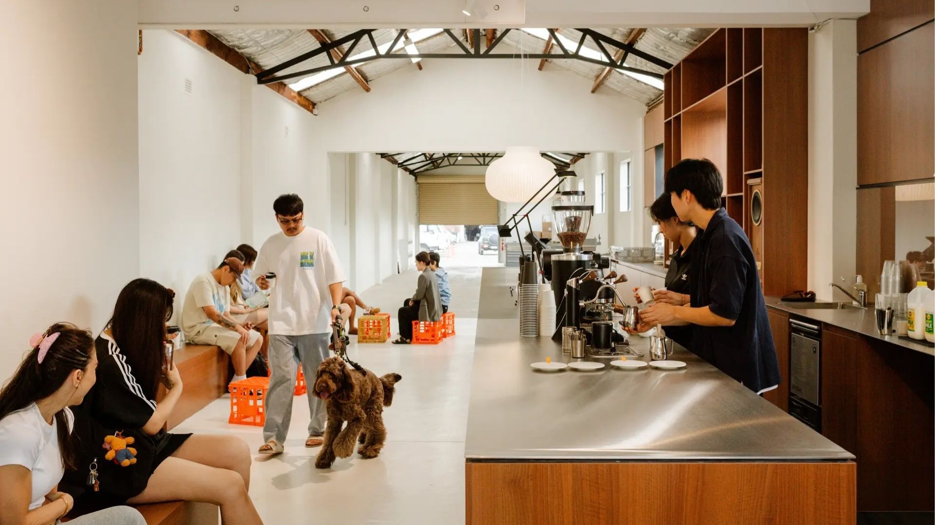 Modern Sydney café with customers and a barista at work.