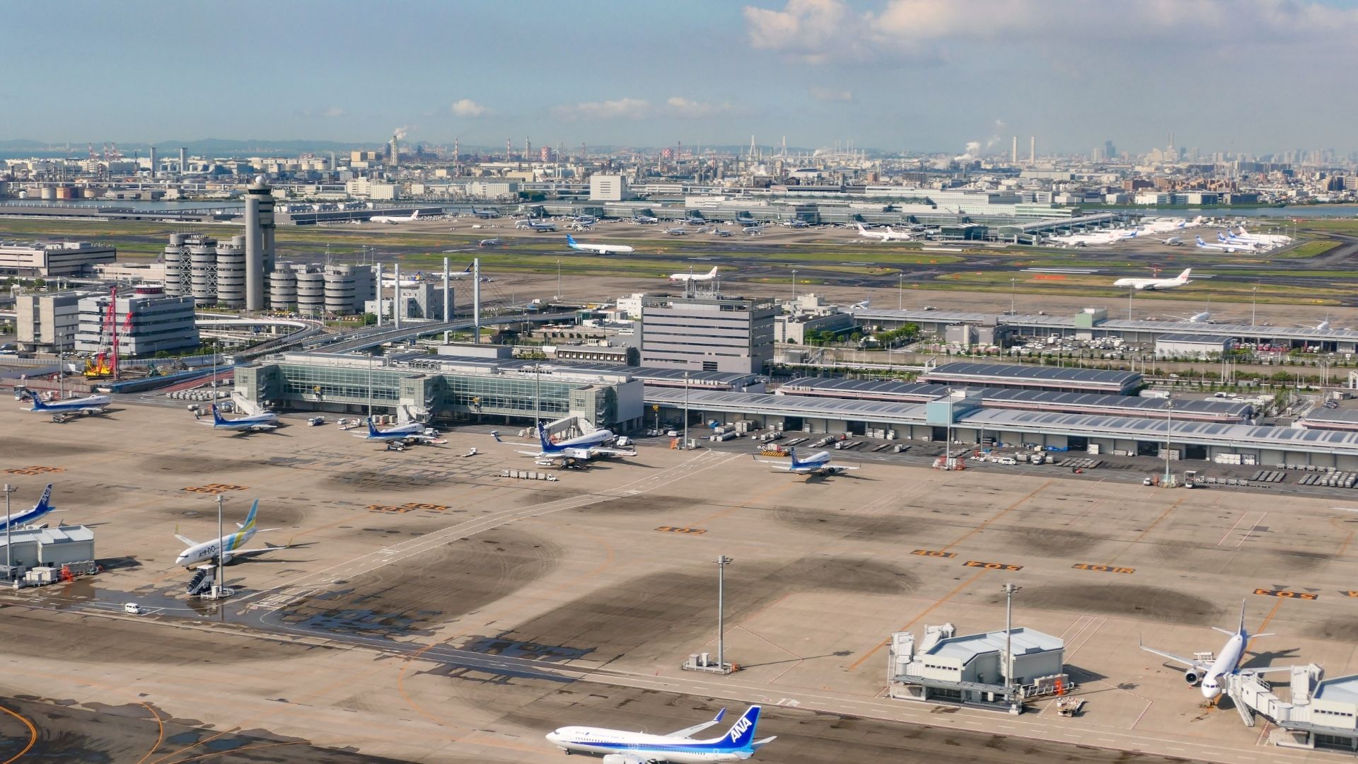 Tokyo Haneda Airport aerial view with runways, terminals and aircraft