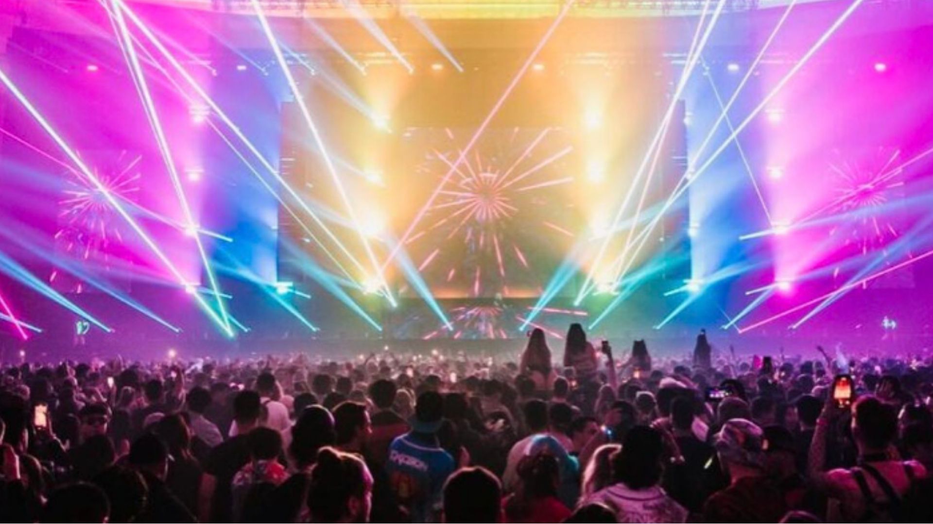 Festival-goers enjoying electronic music outdoors under a winter sky in Vancouver