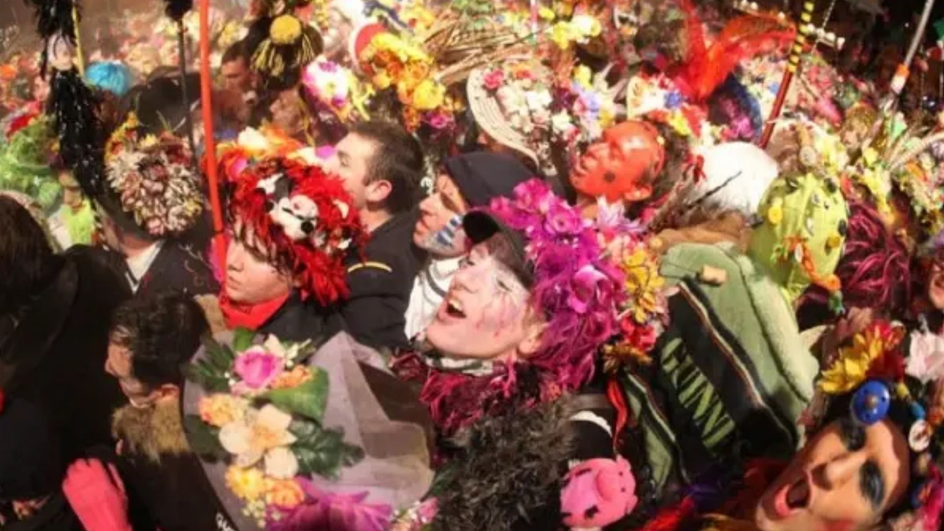 Costumed performers marching during Dunkirk Carnival street parade