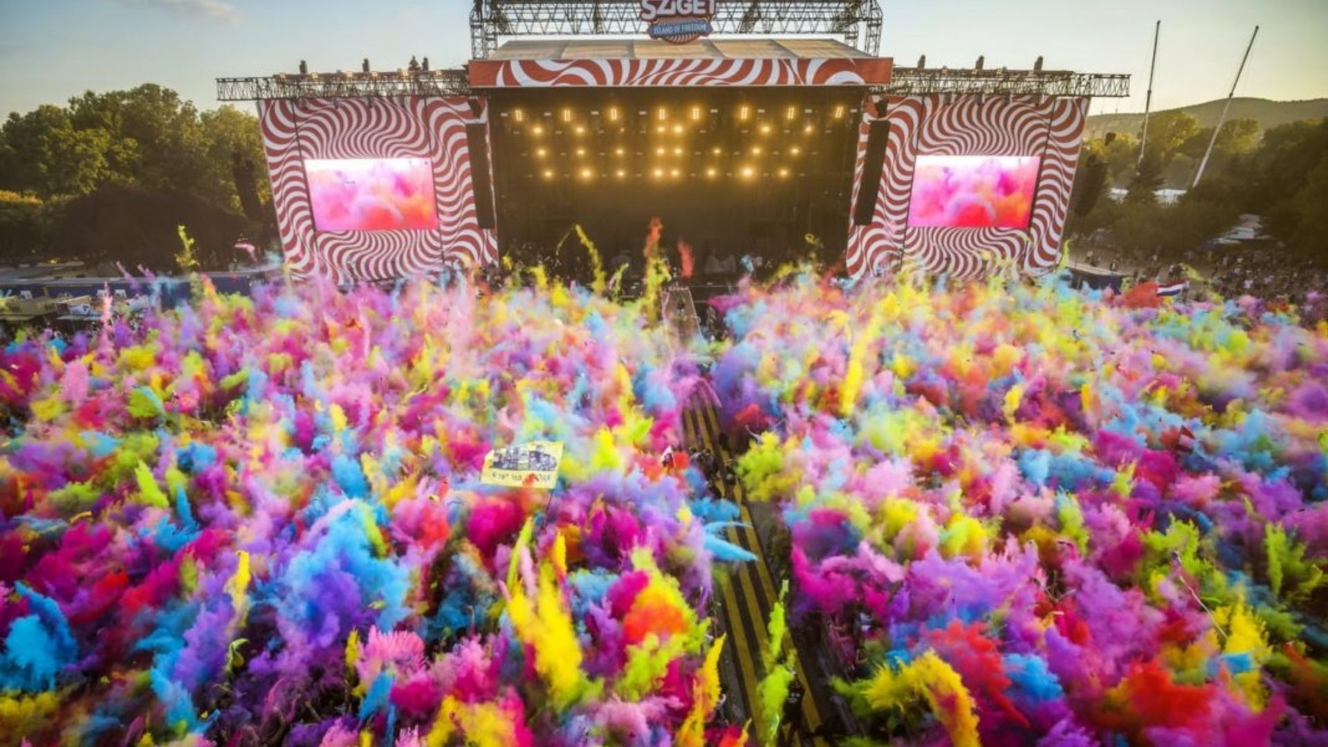 Open air music festival near Paris with crowd watching a main stage performance