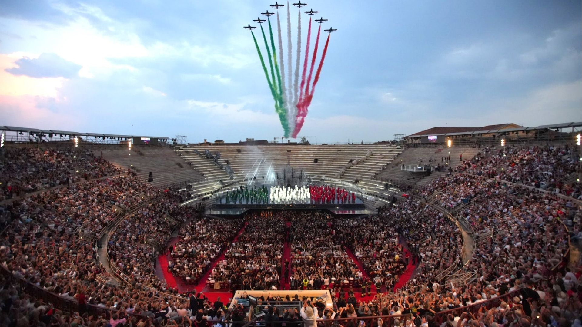 Crowd watching performance at Verona Arena during summer festival in Italy