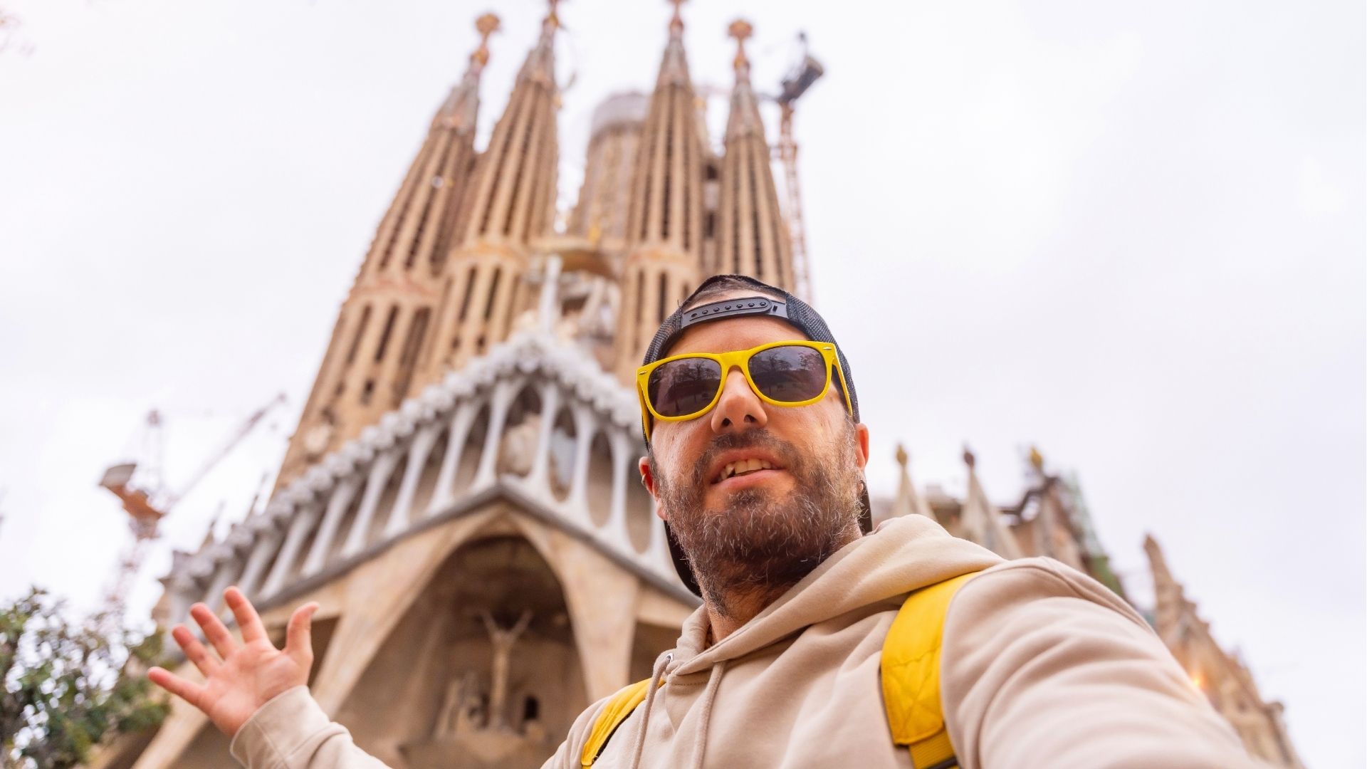Selfie of a tourist in sunglasses at the Sagrada Familia Basilica in Barcelona, Spain
