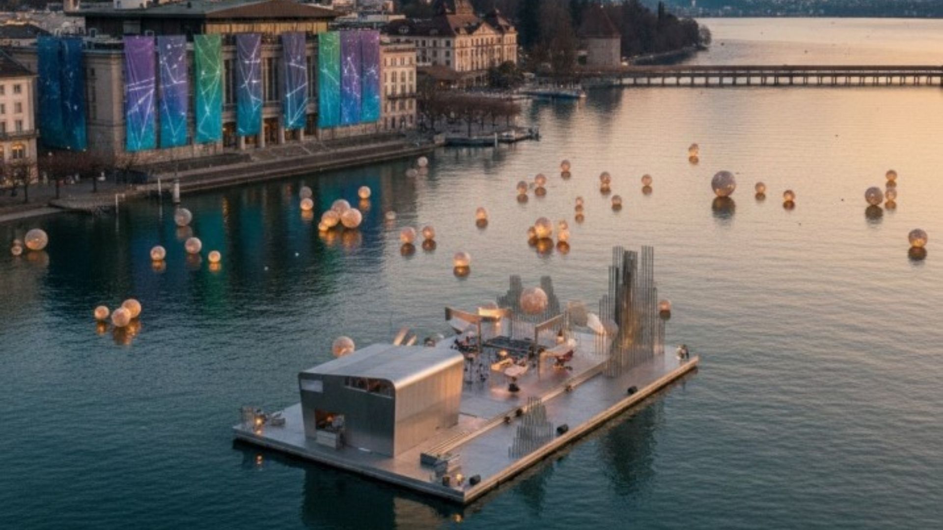 Floating stage performance on Lake Lucerne during a festival with illuminated spheres and lakeside concert hall backdrop