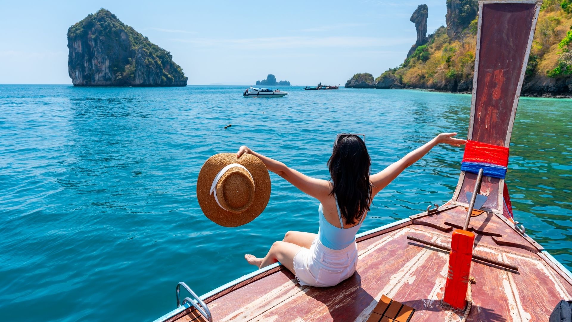 Young Asian woman relaxing and enjoying at Chicken island in Krabi Thailand
