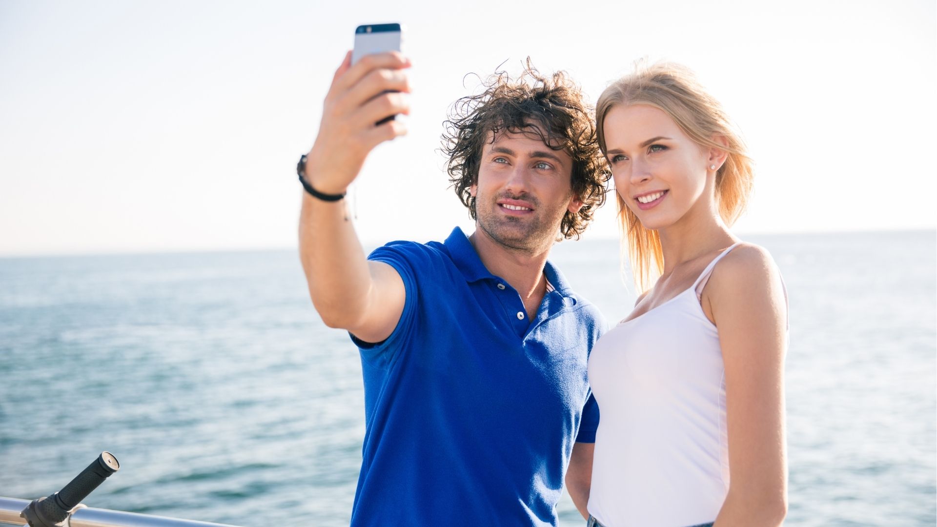 Couple Taking Selfie By the Ocean on Vacation
